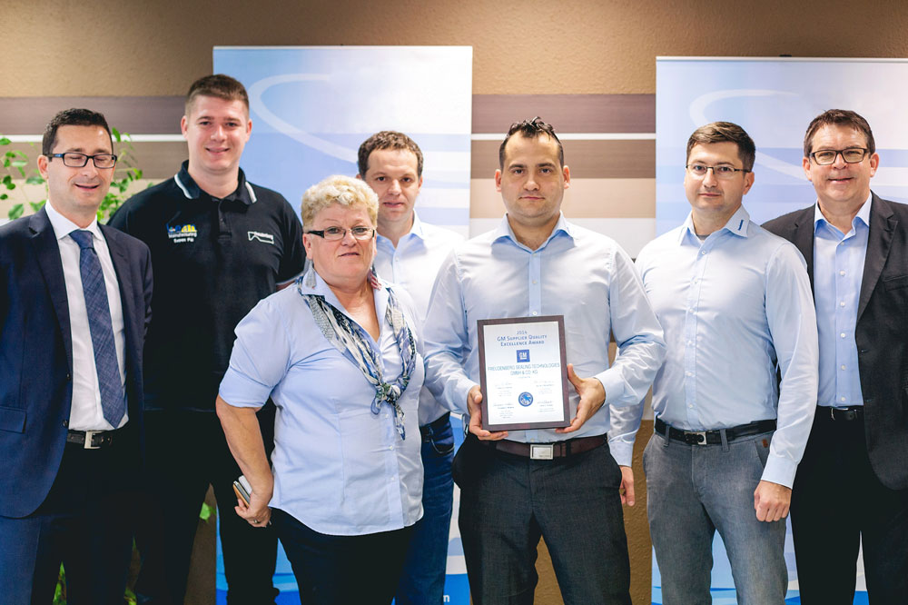 Group of people presenting an Award