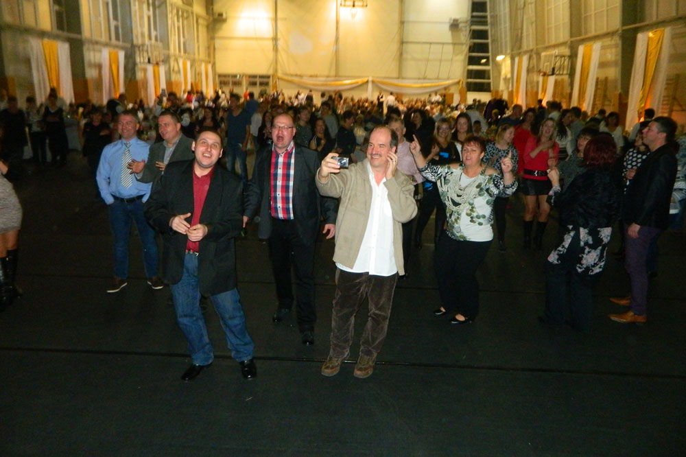 Several employees celebrate in a hall