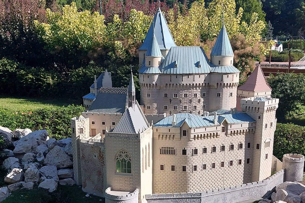 Photography of a castle with pointed towers